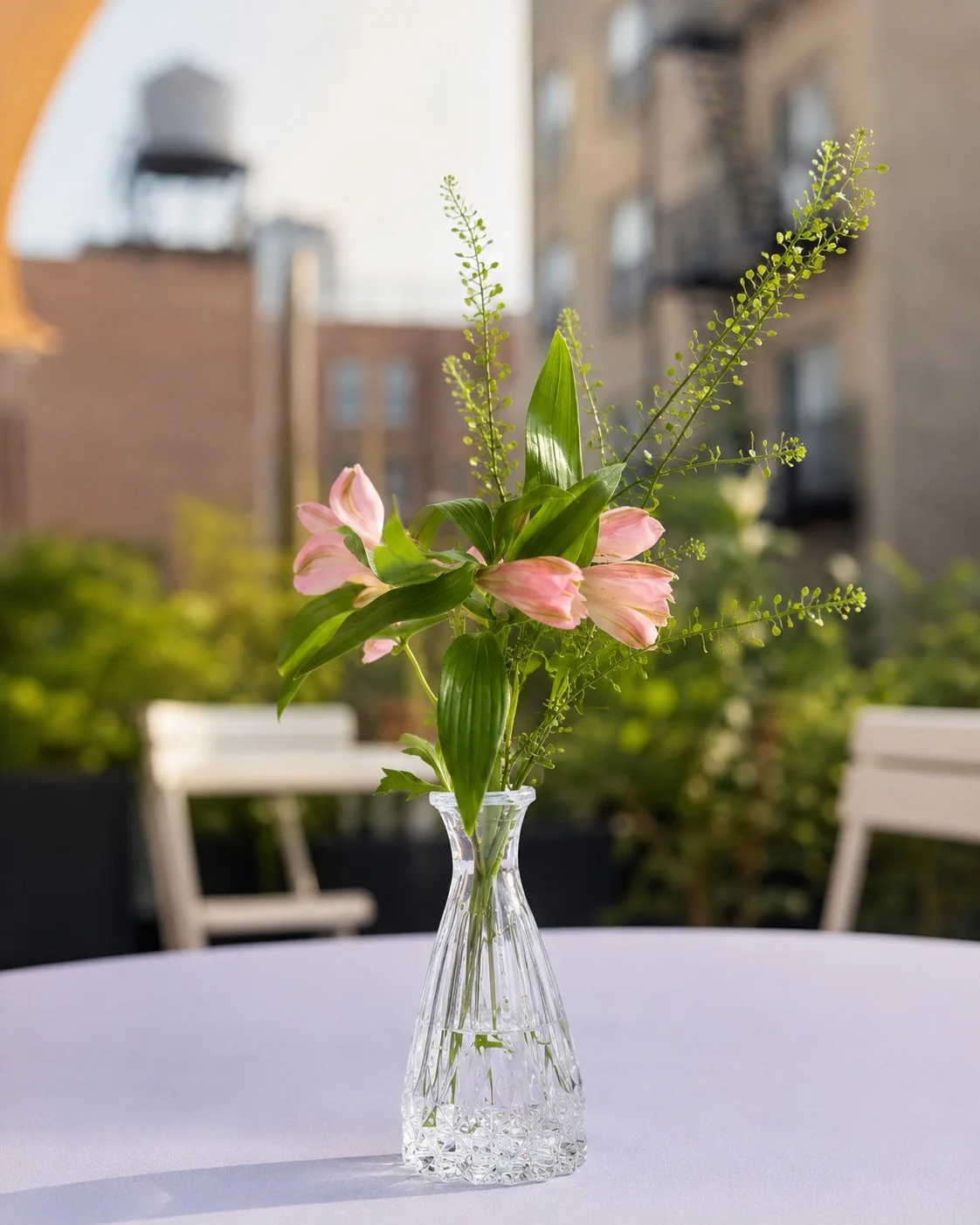 Single-stem floral styling on a terrace