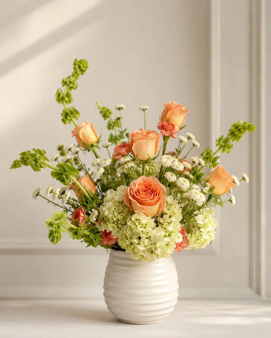 Peach and green floral vase arrangement